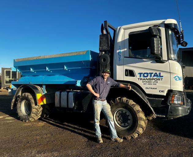 Bailey Mitchell, of Total Transport Otago Ltd, with one of the trucks that will be on display...