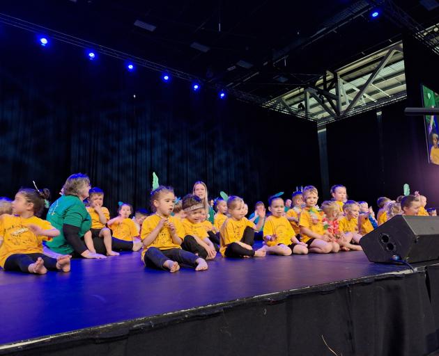 Surrey Park Early Learning Centre children sit during their performance.