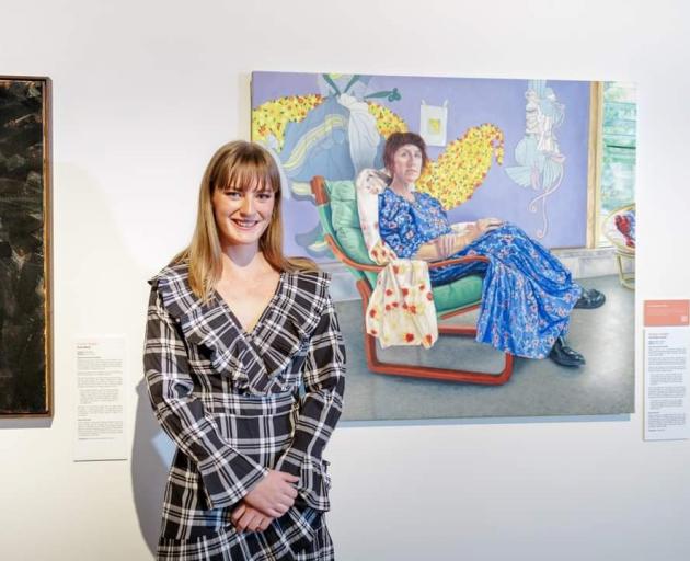 Former St Hilda's Collegiate student, Imogen Corbett, in front of her portrait of Natalia Hughes...