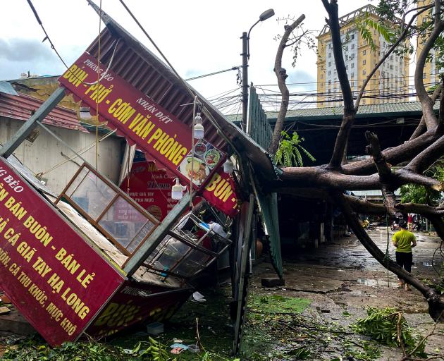 Trees were toppled and infrastructure damaged in Hanoi as Typhoon Yagi hit the Vietnamese capital...