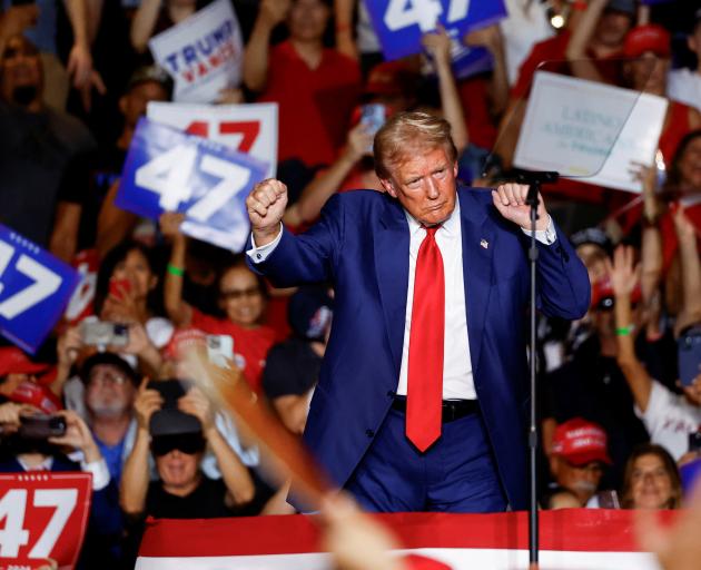 Donald Trump celebrates another successful assault on the English language. PHOTO: REUTERS