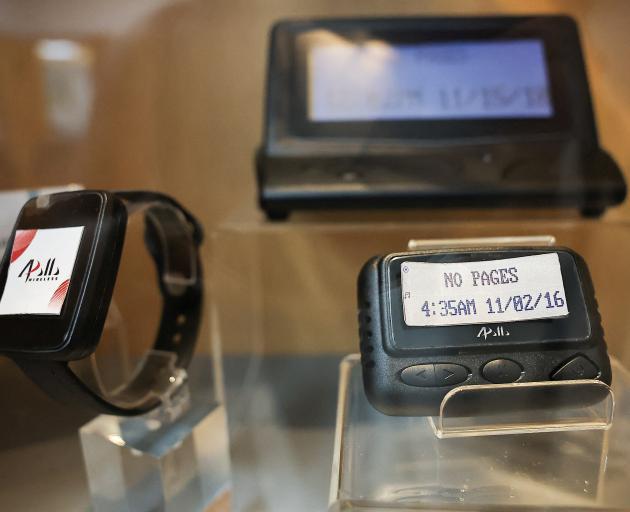 Pagers on display at a meeting room at the Gold Apollo company building in New Taipei City,...