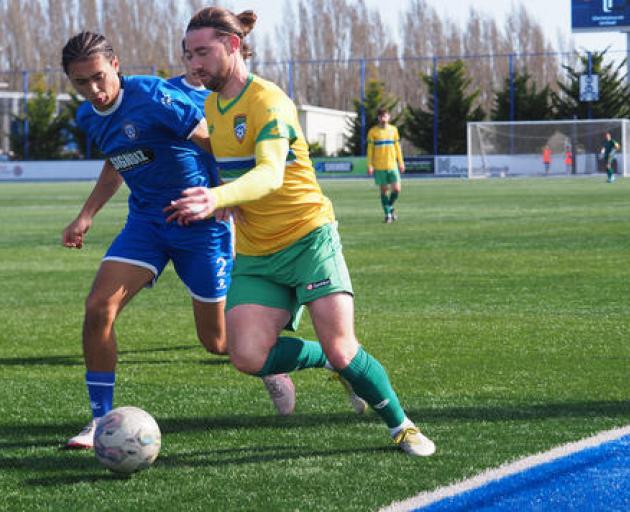 Cashmere Technical's Garbhan Coughlan tussling with Christchurch United's Rico Pradhan last...