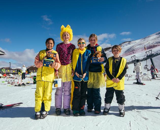 Paint the peak yellow... Hitting the slopes at Coronet Peak on Daffodil Day are (from left)...