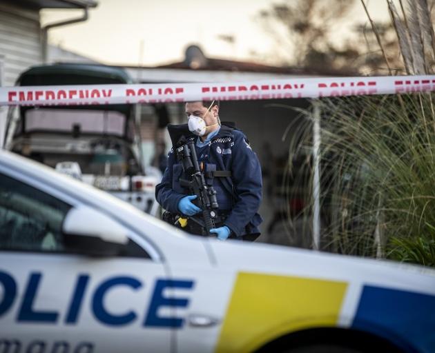 Police guard the scene of an Auckland murder. PHOTO: NZ HERALD