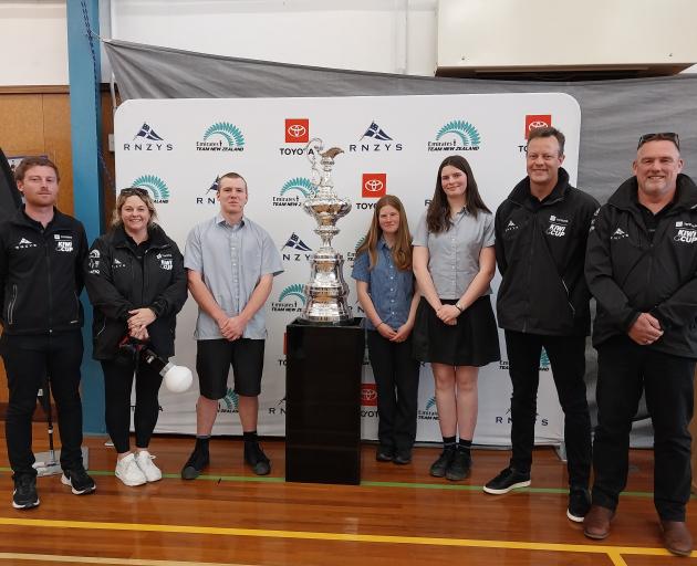 Posing with the America's Cup at Mount Aspiring College (MAC) on Tuesday afternoon are (from left...