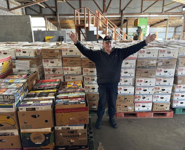 David Mead and his fellow volunteers are moving thousands of books into the Sports Hall on...