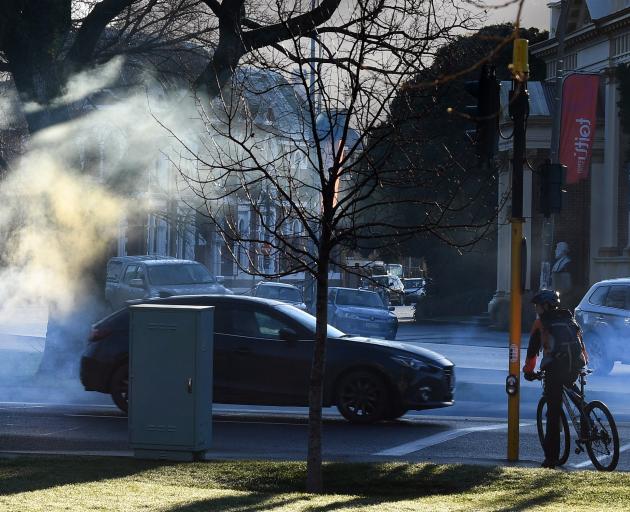 A car idles at the lights in Queens Gardens, Dunedin. An Otago Regional Council emissions...