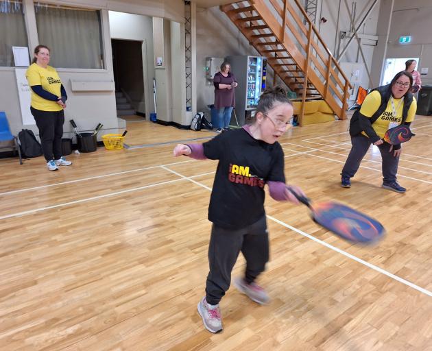 Darcy McDowall, 11, rules the pickleball court as volunteer Kit Pryde (back) and Active Southland...