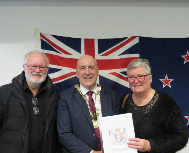 New citizen Jacqui Hopkins with husband Ashley and Central Otago District Mayor Tim Cadogan ...