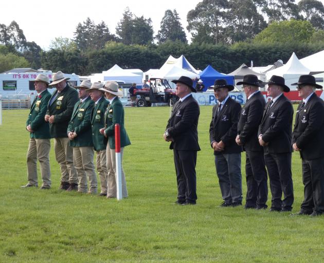 Australian and New Zealand team members line up for the national anthem before last year’s...