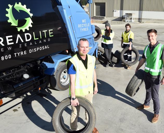 Loading tyres into Treadlite’s tyre recovery truck are (from left) Dynes Transport chief...