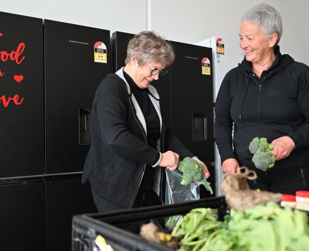 Handling fresh produce delivered to Food For Love's new premises on Gordon Rd, Wanaka, are Food...