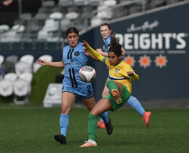 Dunedin City Royals captain Rose Morton (left) tries to defend the pass of Cashmere Technical...