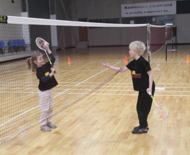 Georgia Shefford, 6, leads her big brother Liam, 7, in their badminton match.


