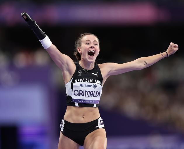 Anna Grimaldi celebrates her 100m bronze medal at the Paralympics. PHOTO: GETTY IMAGES