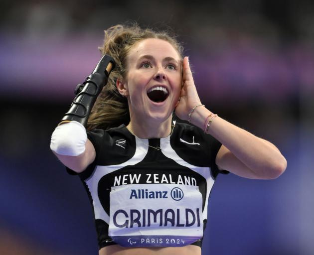 The moment Anna Grimaldi realised she won gold in the women's 200m T47 final. Photo: Getty Images 