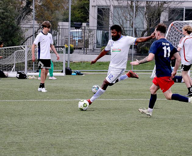 Canterbury Fiji Navua defender Laitia Tuilau clears the ball under pressure from Joe’s Bower 11...