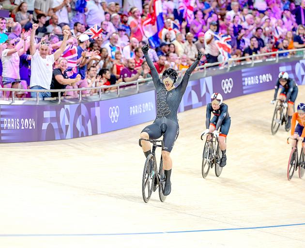 Ellesse Andrews crosses the finish line in the keirin to win gold. She finished the Paris...