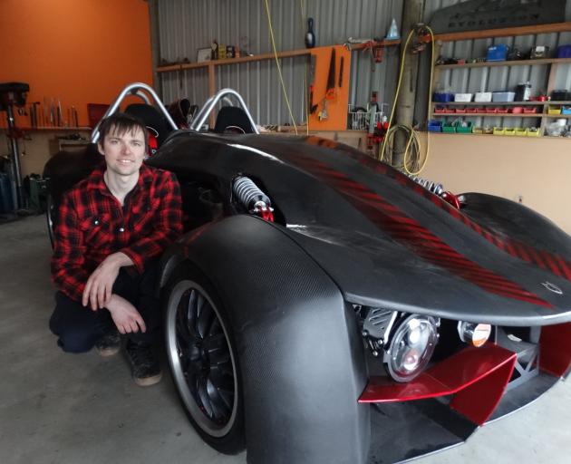 Oamaru man Josh Lee with his scratch-built car that he plans to enter in Oamaru drag racing and...