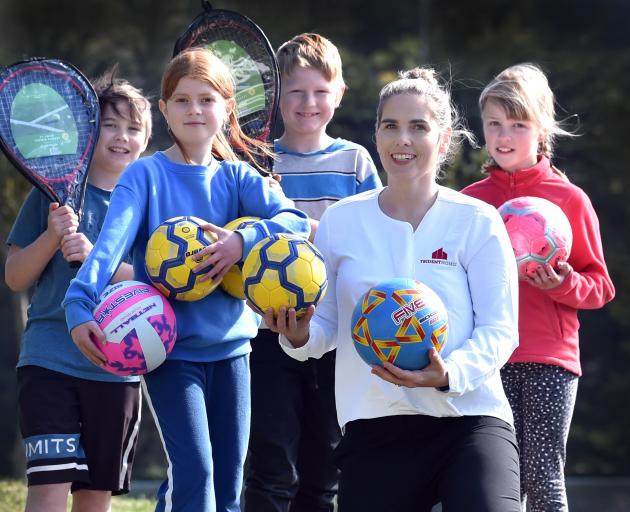 Enjoying their new sports equipment are Port Chalmers School pupils (from left) Paxton More, 11,...