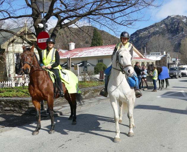 Queenstown riders Kate Pirovano (left), on Jimmy, and Kaye Eden, on Banjo, ride in Arrowtown’s...