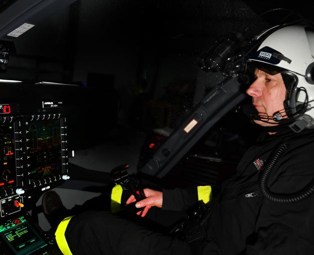 Helicopters Otago pilot Steve Clarke sits at the controls of the helicopter that was targeted by...