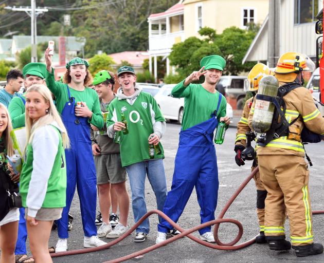 Students and firefighters on Castle St. Photo: Stephen Jaquiery