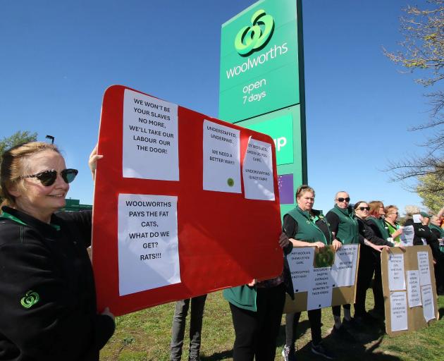 Workers from the Woolworths supermarket in Amberley line State Highway 1 on both sides as they...