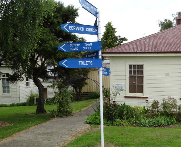 The Taieri Historical Museum and Park signpost points the way to many buildings from the early...