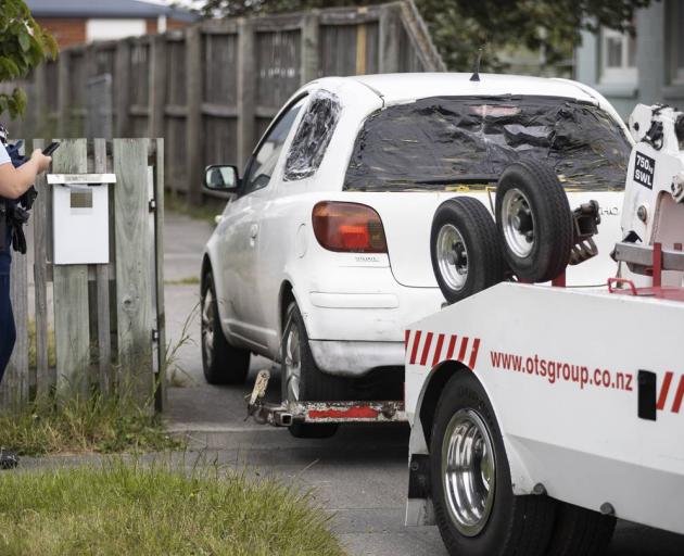 A white car, similar to one sought by police in relation to the stabbing, was towed away after...