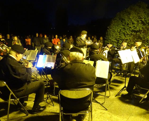 As the eastern sky began to lighten a performance by the visiting New Zealand Veterans Brass Band heralded the start of the proceedings. Photo: Kerrie Waterworth