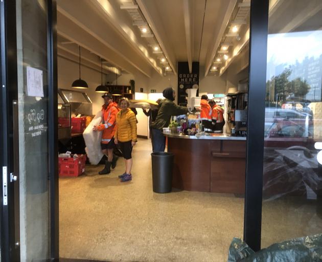 People clear out items and furniture from Big Fig in Wanaka this morning. Photo: Kerrie Waterworth