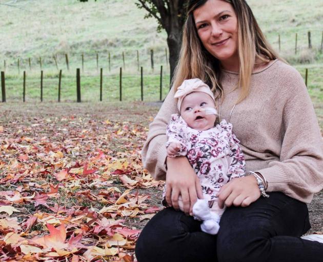 Natalie Izatt with her 4-month old daughter Brooklyn Izatt. Brooklyn was in intensive care after...