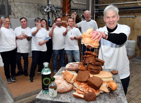 Sue Stockwell wrings out a loaf as Dunedin Craft Distillers celebrate saving 10tonnes of bread...