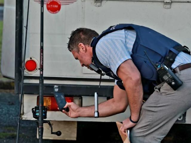 Police investigating at the scene. Photo: RNZ / Nick Monro