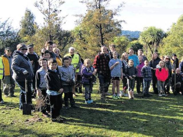 Unselfish act . . . People prepare to plant trees in the Town Belt. PHOTO: SUPPLIED