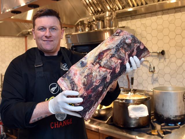 Executive chef Greg Piner with dry-aged meat at the new Prohibition Smokehouse. PHOTO: PETER...