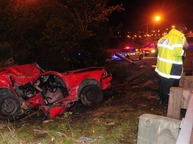 Police attend a serious accident on the Southern Motorway near Green Island on Saturday night....