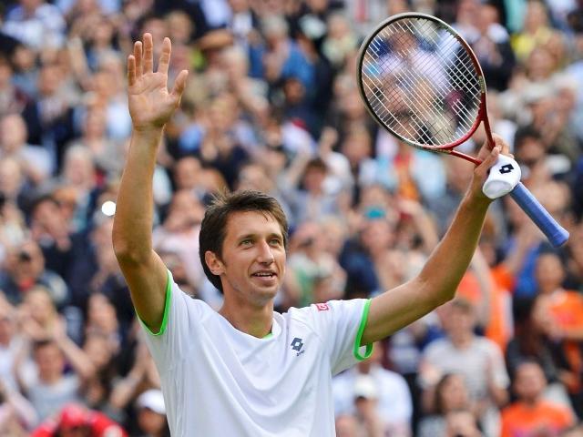 Sergiy Stakhovsky of Ukraine reacts after defeating Roger Federer of Switzerland in their men's...