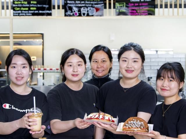 Crazy Waffle staff members (from left) Louise Kim, Hamin Yun, Ellie Jung, Lily Kim and Na Hyun...