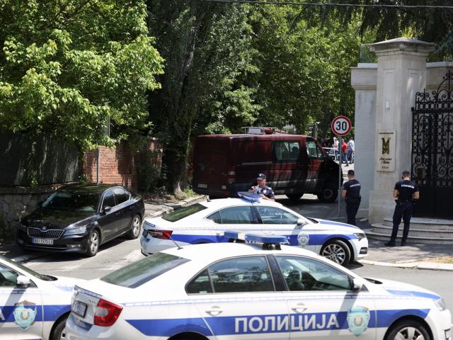 Police officers secure the area after the attack near the Israeli embassy in Belgrade. Photo:...