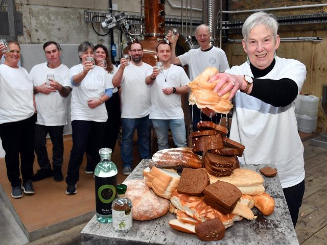 Sue Stockwell wrings out a loaf as Dunedin Craft Distillers celebrate saving 10tonnes of bread...