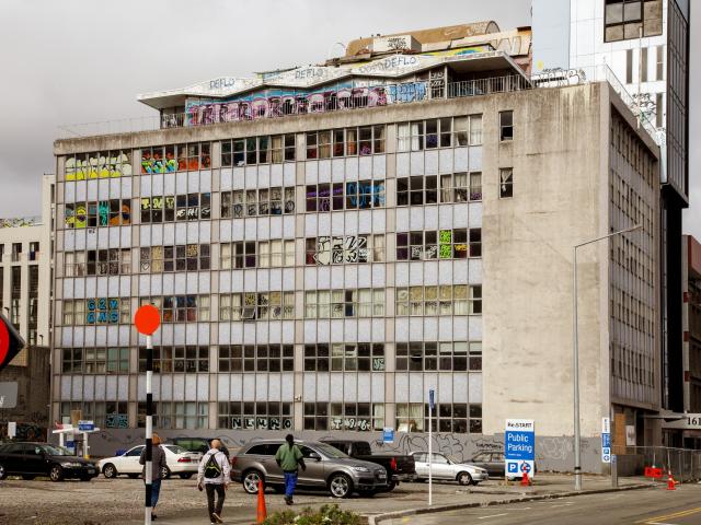 The quake damaged building on Hereford St attracted squatters and graffiti for more than a decade...