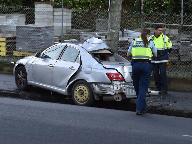 Police at the crash scene tonight. PHOTO: PETER MCINTOSH