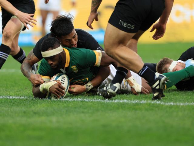 All Black Reiko Ioane can't stop South Africa captain Siya Kolisi from scoring a try. Photo:...