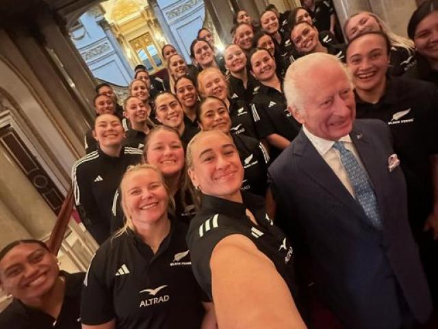 Britain's King Charles III poses for a photograph with members of New Zealand's Black Ferns rugby...