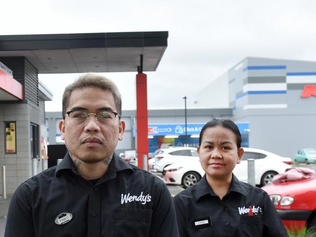 Dunedin Wendy’s Hamburgers general manager Paul Abordonado (left) and staff Lanie Geron and Caleb...