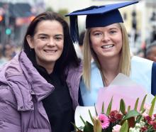 Paralympic athlete Holly Robinson, 29, with friend and bachelor of applied science graduate...