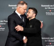 Poland's President Andrzej Duda (left) is welcomed by Ukraine leader Volodymyr Zelenskyi at the...